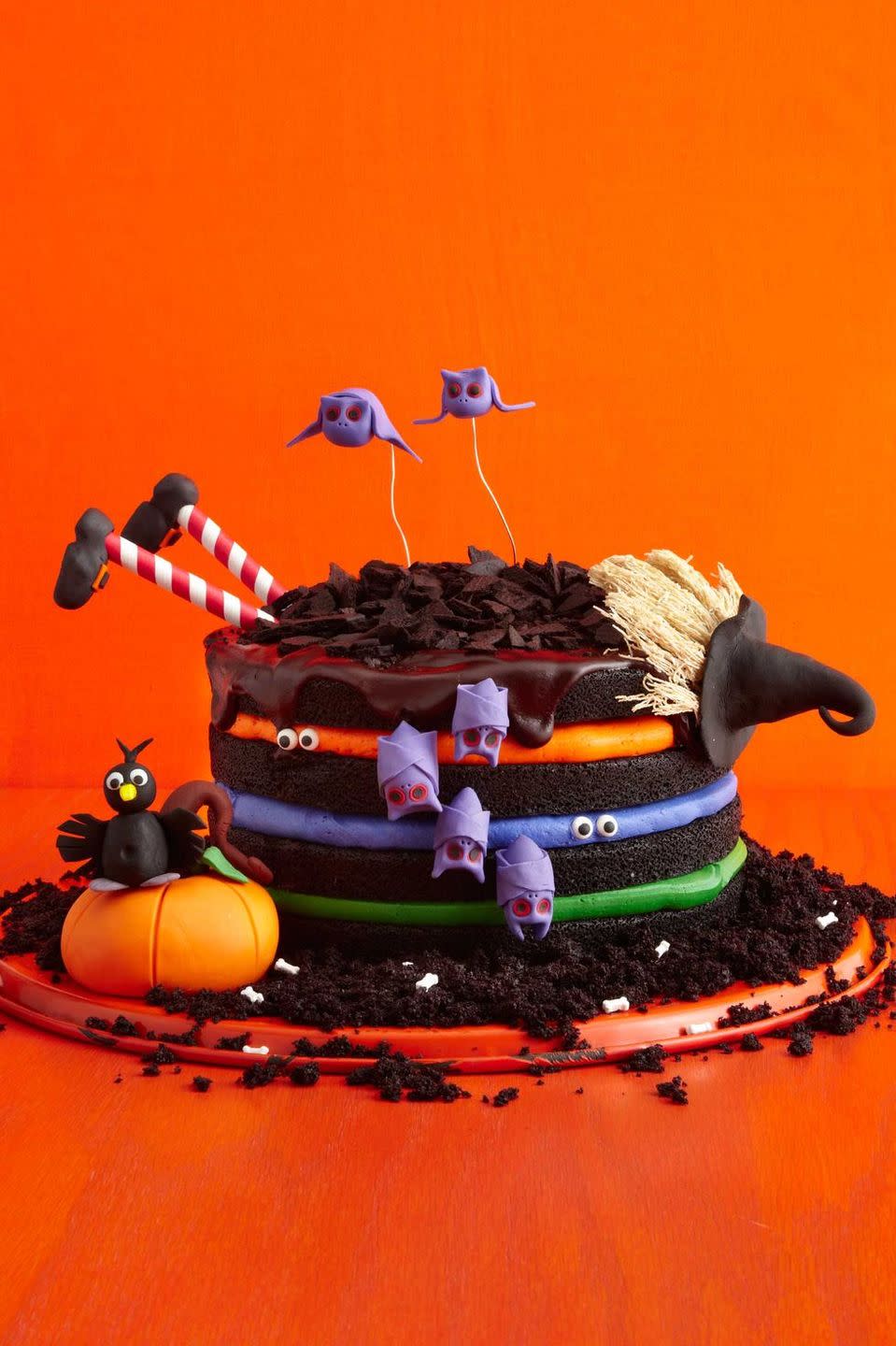 <p>You don't need a special spell to put together this fun black chocolate witch cake — just colorful buttercream and spooky decorations.<em><br><br><a href="https://www.womansday.com/food-recipes/food-drinks/recipes/a51843/black-chocolate-cake/" rel="nofollow noopener" target="_blank" data-ylk="slk:Get the recipe for Black Chocolate Witch Cake;elm:context_link;itc:0;sec:content-canvas" class="link ">Get the recipe for Black Chocolate Witch Cake</a>.</em><br></p>