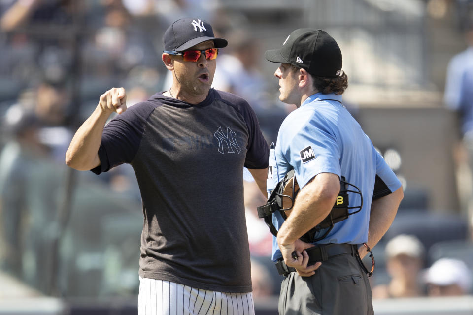 New York Yankees manager Aaron Boone, outfielder Brett Gardner and pitcher CC Sabathia were all ejected during Saturday's game against the Cleveland Indians. (AP Photo/Mary Altaffer)