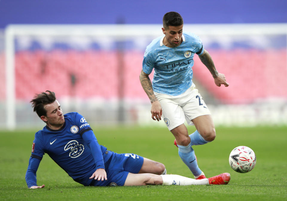 Chelsea's Ben Chilwell (left) and Manchester City's Joao Cancelo battle for the ball during the FA Cup semi final match at Wembley Stadium, London. Picture date: Saturday April 17, 2021.