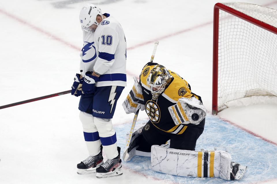 Boston Bruins' Linus Ullmark (35) deflects a shot despite the screen from Tampa Bay Lightning's Corey Perry (10) during the second period of an NHL hockey game, Saturday, March 25, 2023, in Boston. (AP Photo/Michael Dwyer)