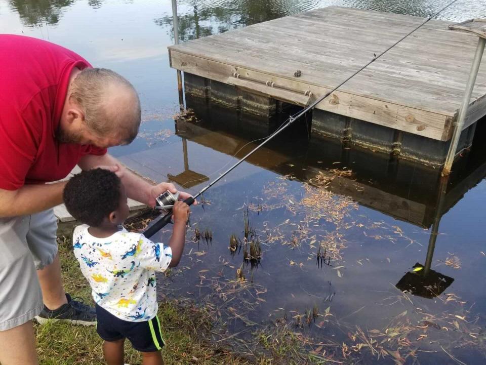 Matthew Moore fishes with his son Marshall