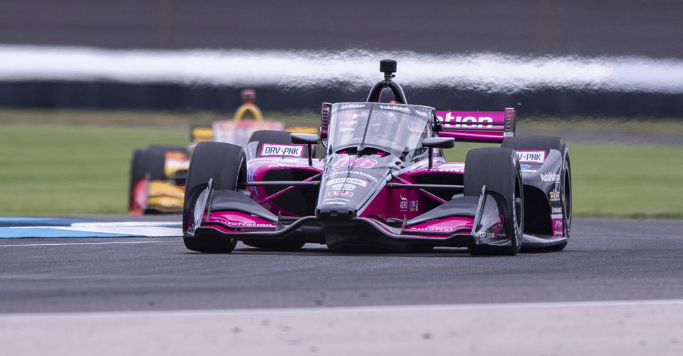 Helio Castroneves, of Brazil, drives along the course during a practice session for the IndyCar auto race at Indianapolis Motor Speedway, Friday, Aug. 13, 2021, in Indianapolis. (AP Photo/Doug McSchooler)