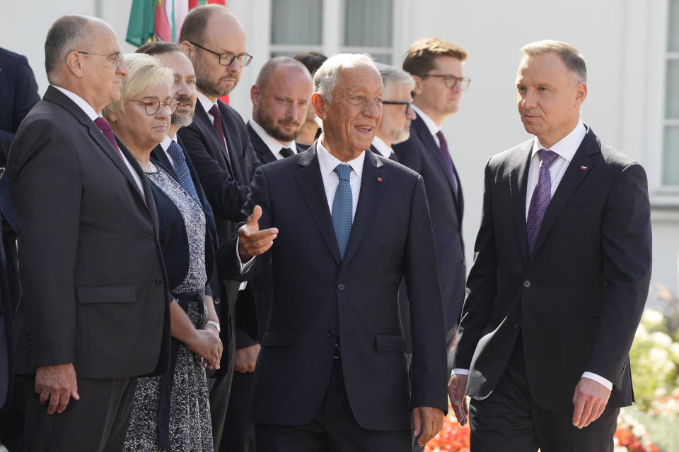 Poland's President Andrzej Duda, right, greets Portuguese President Marcelo Rebelo de Sousa during a state visit at the Belvedere Palace in Warsaw, Poland, Tuesday, Aug. 22, 2023. At a joint news conference de Sousa vowed continuing support for Ukraine's struggle against Russia's invasion, while Duda said Poland is watching Russia's transfer of some nuclear weapons into neighbouring Belarus. (AP Photo/Czarek Sokolowski)