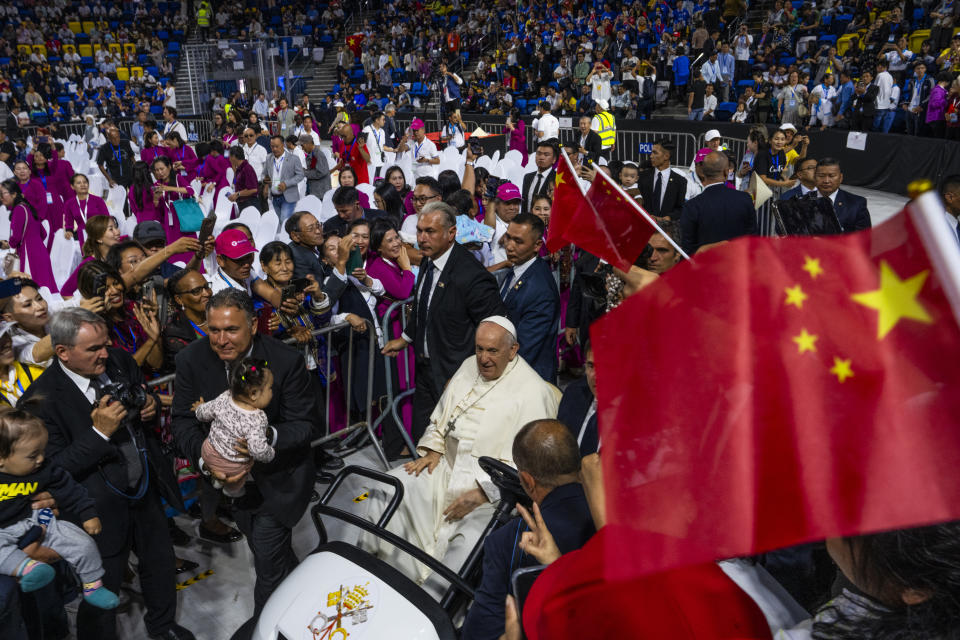 Pope Francis arrives to preside over a mass at the Steppe Arena in the Mongolian capital Ulaanbaatar, Sunday, Sept. 3, 2023. Francis is in Mongolia to minister to one of the world's smallest and newest Catholic communities. Neighboring China's crackdown on religious minorities has been a constant backdrop to the trip, even as the Vatican hopes to focus attention instead on Mongolia and its 1,450 Catholics. (AP Photo/Louise Delmotte)