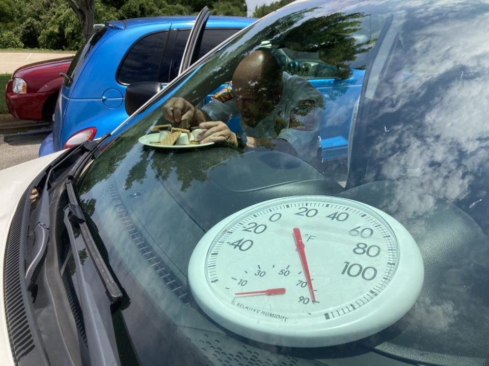 Gastonia Fire Department safety administrator Jim Landis puts some S'Mores inside a car on Thursday, July 7, outside the departments Myrtle School Road headquarters as part of a demonstration to show how hot cars can become on a hot day.