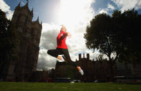 LONDON, ENGLAND - SEPTEMBER 13: Gymnast Nastia Liukin of the USA poses in front of Westminster Abbey during a tour of London on September 13, 2011 in London, England. (Photo by Bryn Lennon/Getty Images for USOC)