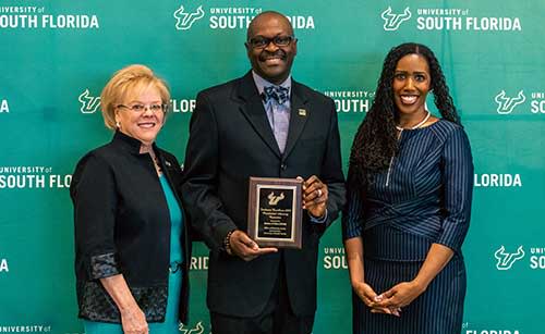Darren Gambrell (center) with President Rhea Law and Elizabeth Hordge-Freeman, interim vice president of institutional equity and senior advisor to the president and provost for diversity and inclusion at Inclusive Excellence Award ceremony in April 2022.