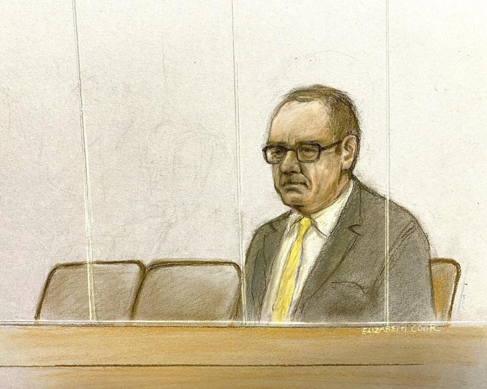 Court artist sketch by Elizabeth Cook of actor Kevin Spacey in the dock at Southwark Crown Court, London, Friday, June 30, 2023. Spacey is going on trial on charges he sexually assaulted four men as long as two decades ago. The double-Oscar winner faces a dozen charges at Southwark Crown Court. Spacey pleads not guilty to all charges. (Elizabeth Cook/PA via AP)