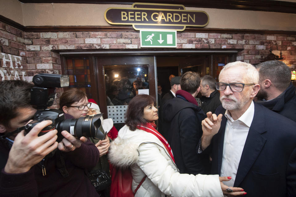 Labour leader Jeremy Corbyn and his wife Laura Alvarez during a visit to the Royal Scot Pub in Carlisle, England while on the General Election campaign trail, Tuesday Dec. 10, 2019. (Joe Giddens/PA via AP)