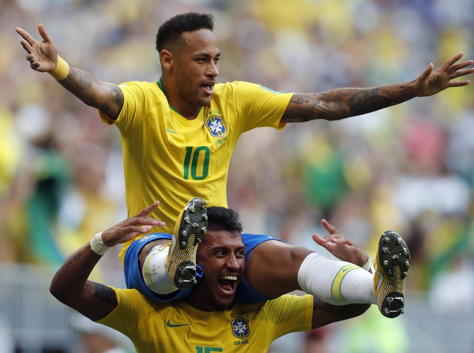 <p>Brazil’s Neymar, top, celebrates with team mate Paulinho after scoring his side’s opening goal during the round of 16 match between Brazil and Mexico at the 2018 soccer World Cup in the Samara Arena, in Samara, Russia, Monday, July 2, 2018. (AP Photo/Frank Augstein) </p>