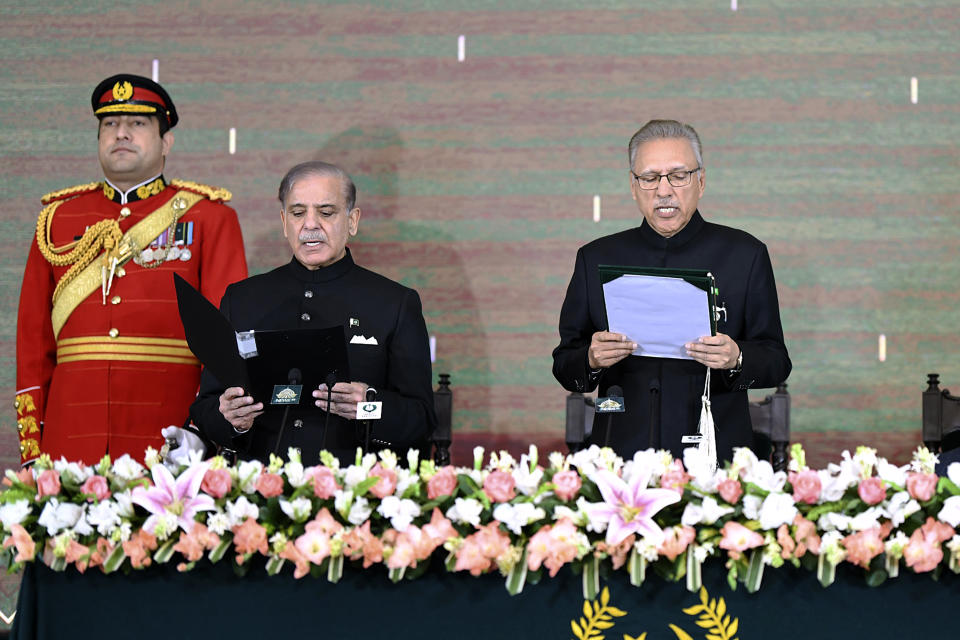 In this photo released by the Pakistan's President Office, President Arif Alvi, right, administers the oath of office to newly elected Prime Minister Shehbaz Sharif during a ceremony at the Presidential Palace, in Islamabad, Pakistan, Monday, March 4, 2024. Lawmakers in Pakistan's National Assembly have elected Sharif for a comeback term as the country's prime minister, as allies of imprisoned former premier Imran Khan in parliament shouted in protest, alleging rigging in last month's election. (Pakistan's President Office via AP)