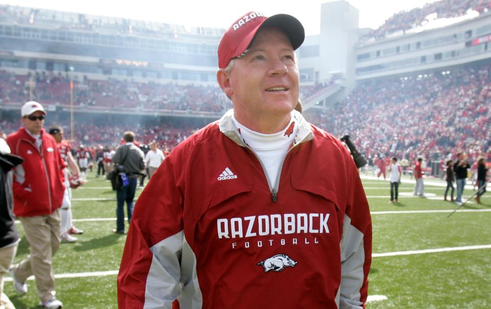 Arkansas coach Bobby Petrino looks at the scoreboard as walks off the field after tjheir 44-23 victory over Auburn in an NCAA college football game in Fayetteville, Ark., Saturday, Oct. 10, 2009. (AP Photo/Danny Johnston)
