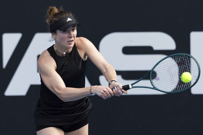 FILE- Elina Svitolina of Ukraine plays against Caroline Wozniacki of Denmark during her singles match at the ASB Classic tennis tournament in Auckland, New Zealand, on Jan. 2, 2024. The first 15-day Australian Open sets to start Sunday morning, Jan. 14, 2024. (Brett Phibbs/Photosport via AP, File)