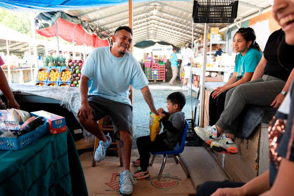 Juan Garcia enjoys quality time with his family at the Buckhorn Flea Market on Saturday, June 15, 2024. The family has spent Saturday’s at the market for years and will even sleep at their stand to ensure they have a prime location to sell at.