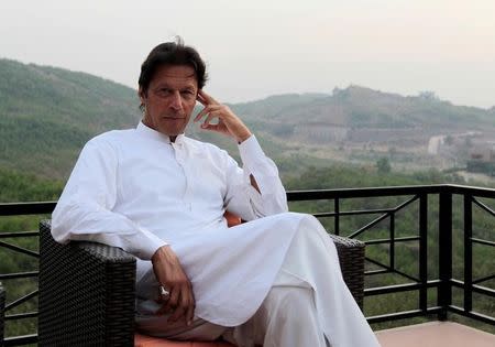 Pakistani opposition politician Imran Khan speaks with party leaders at his home in Bani Gala, outside Islamabad, Pakistan October 30, 2016. REUTERS/Caren Firouz