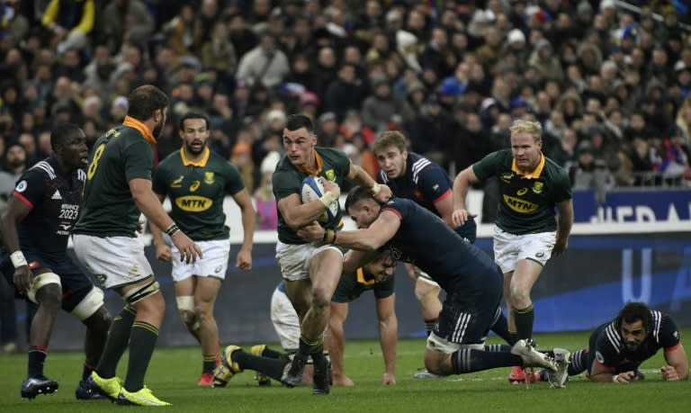 South Africa's Jesse Kriel (C) makes a break against France during their friendly international at The Stade de France