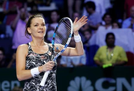 Tennis - Singapore WTA Finals Round Robin Singles - Singapore Indoor Stadium, Singapore - 28/10/2016 - Agnieszka Radwanska of Poland celebrates after defeating Karolina Pliskova of the Czech Republic REUTERS/Edgar Su