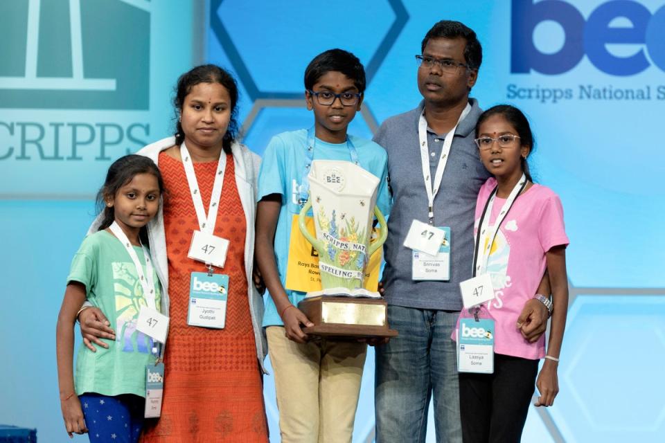 Bruhat with his family after winning the Scripps National Spelling Bee (AP)