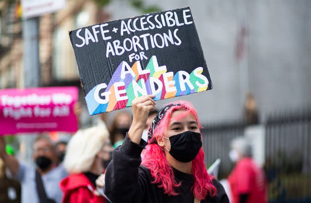 A protester highlights the need for trans-inclusive abortion service at an October 2021 gathering organized by NYC for Abortion rights outside St. Paul's Roman Catholic Church in New York City. (Photo: KENA BETANCUR via Getty Images)