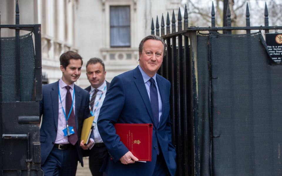 Lord Cameron, the Foreign Secretary, is pictured this morning arriving in Downing Street