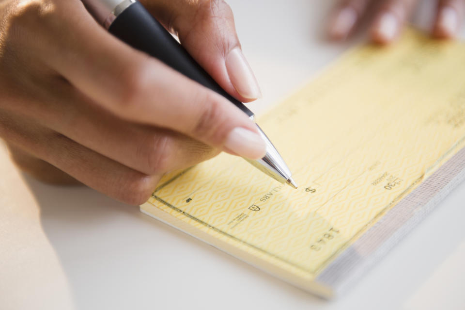 a pen about to write a check