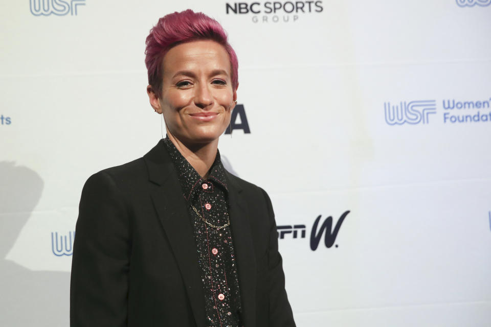 In this Wednesday, Oct. 16, 2019, photo soccer star Megan Rapinoe poses for photos on the red carpet of the Women's Sports Foundation's 40th annual Salute to Women in Sports in New York. Rapinoe, who was honored at the gala, won Sportswoman of the Year in the team category. She led the U.S. women's soccer team to victory at the World Cup in France and earned the FIFA Player of the Year award. (AP Photo/Mary Altaffer)