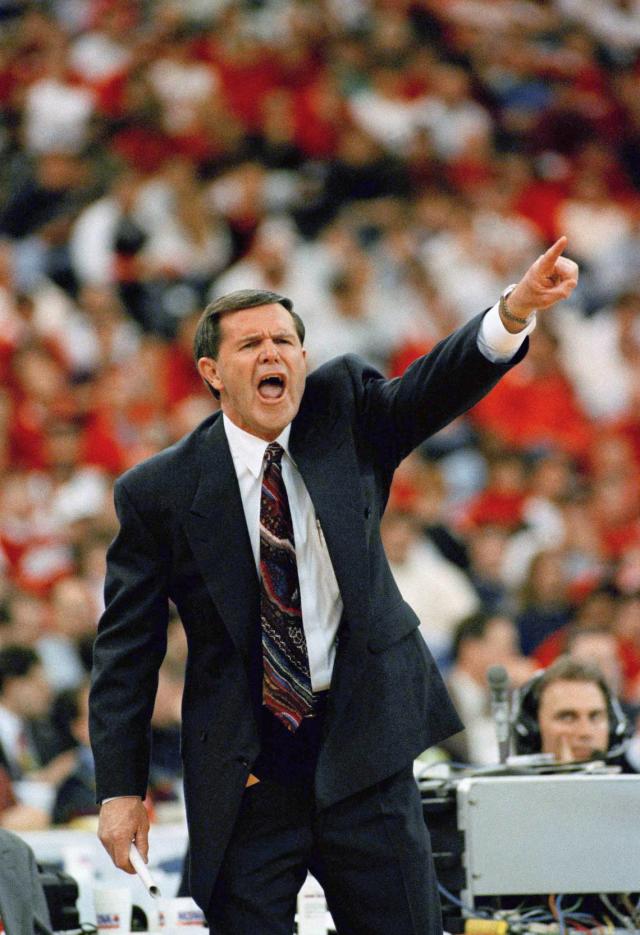 Former U of L coach Denny Crum shows off his sports collection