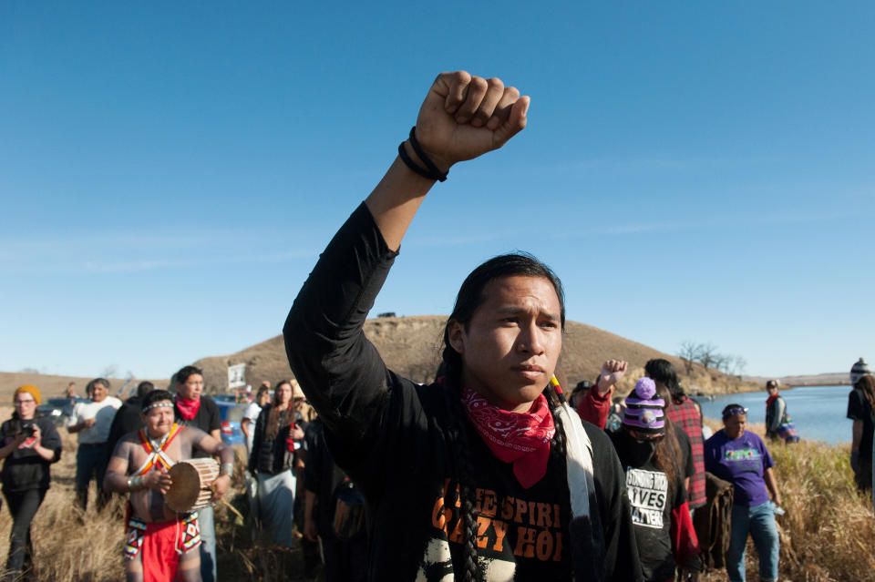 <p>People protest against the building of a pipeline on the Standing Rock Indian Reservation near Cannonball, N.D., on Nov. 2, 2016. (Photo: Stephanie Keith/Reuters) </p>