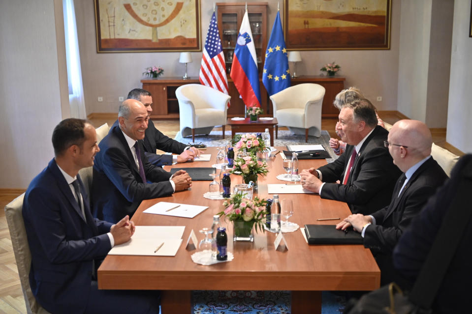 Slovenian Prime Minister Janez Jansa, second left and US Secretary of State Mike Pompeo , second right take part in a meeting in Bled, Slovenia, Thursday, Aug. 13, 2020. Pompeo is on a five-day visit to central Europe with a hefty agenda including China's role in 5G network construction. (Jure Makovec/Pool Photo via AP)