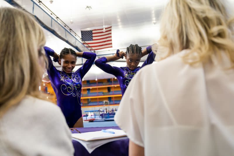 The Wider Image: In Simone Biles' path, a fearless young gymnast learns new 2020 routine