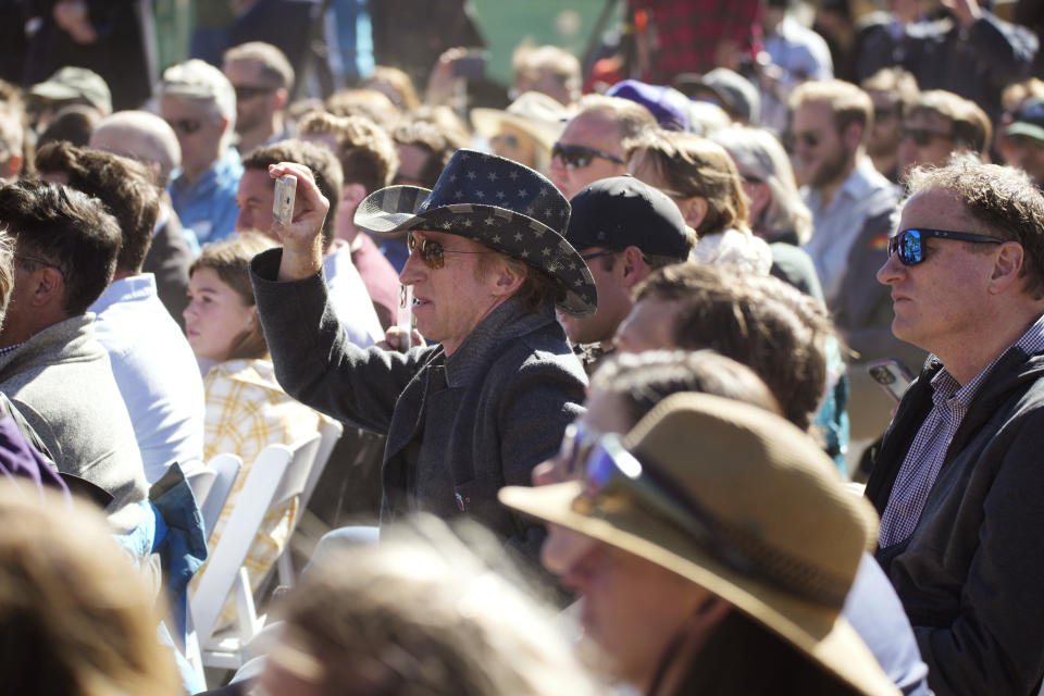 Crowd members listen as President Joe Biden speaks before designating the first national monument of his administration at Camp Hale, a World War II era training site, Wednesday, Oct. 12, 2022, near Leadville, Colo. (AP Photo/David Zalubowski)