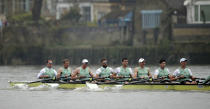 Cambridge rowing crew, with left James Cracknell, 2nd left, in action against Oxford during The Boat Race on the River Thames in London, Sunday April 7, 2019. The 165th annual Boat Race traditionally fought out between Oxford and Cambridge university rowing crews. (Adam Davy/PA via AP)