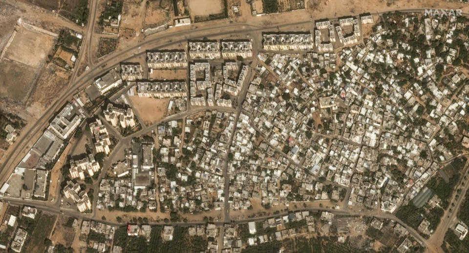 This image provided by Maxar Technologies shows before significant damage in the Izbat Beit Hanoun neighborhood, in northern Gaza, on Oct. 10, 2023. (Satellite image ©2023 Maxar Technologies via AP)