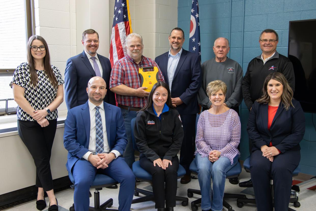 Cintas, the leading supplier of automated external defibrillators in the United States, has donated one to Alliance City Schools' Rockhill Soccer Field House. On hand for the donation event were, front row from left, Nick Samberg, Cintas service manager; Ellie Grescovich, Cintas HR manager; Suzie Dennis, president of Alliance City Schools Board of Education; and Hannah Hamby, Cintas service supervisor; and, back row from left, Olivia Patacca, Cintas sales manager; Mike Smith, Cintas general manager; Nick Cowles, Alliance City Schools' director of operations; Rob Gress, Alliance City Schools superintendent; Bill Koch, Alliance City Schools Board of Education member; and Tyler Kinser, Alliance City Schools Board of Education member.