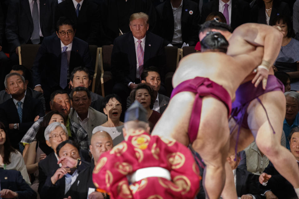 President Donald Trump attends the Tokyo Grand Sumo Tournament with Japanese Prime Minister Shinzo Abe at Ryogoku Kokugikan Stadium, Sunday, May 26, 2019, in Tokyo. (AP Photo/Evan Vucci)