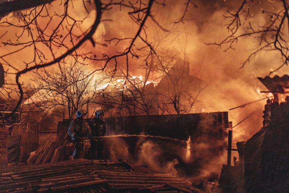 Emergency service workers extinguish a fire after shelling on the Bakhmut front line in Ivanivske, Donetsk Oblast, on Jan. 2, 2023. (Diego Herrera Carcedo/Anadolu Agency via Getty Images)