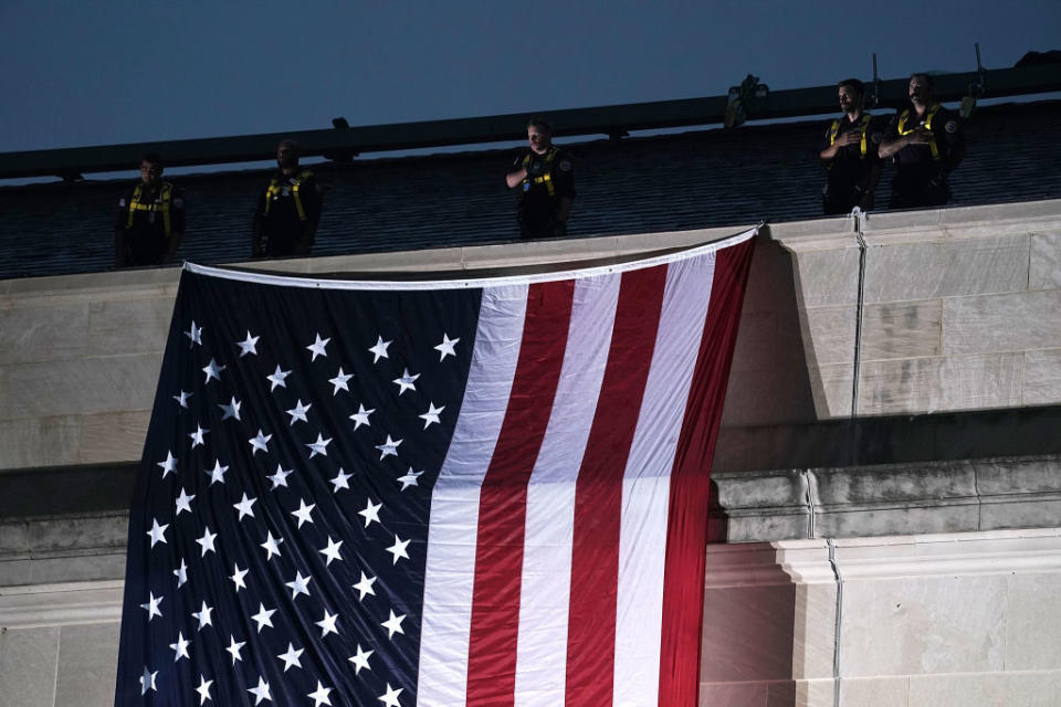 <p>ARLINGTON, VA – SEPTEMBER 11: An American flag is unfurled down the side of the Pentagon to mark the 17th anniversary of the 9/11 terror attacks September 11, 2018 in Arlington, Virginia. The nation observed 9/11 terror attacks that killed nearly 3000 people on American soil in 2001. (Photo by Alex Wong/Getty Images) </p>