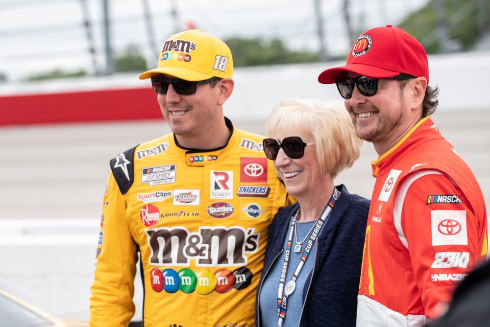 Kyle and Kurt Busch, flanking their mother Gaye at Darlington in 2022.