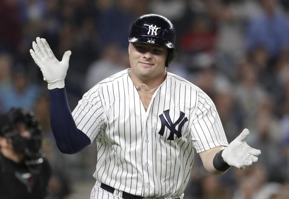 New York Yankees' Luke Voit applauds after hitting a two-run home run off Boston Red Sox starting pitcher David Price during the sixth inning of a baseball game Wednesday, Sept. 19, 2018, in New York. (AP Photo/Julio Cortez)