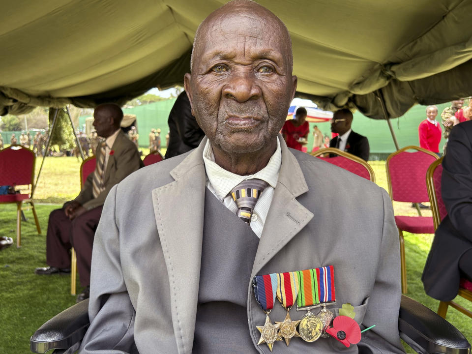 John Kavai Achoga, poses for a photo, after he was awarded replacement medals by Britain's King Charles III, at the Commonwealth War Graves Commission cemetery, in Nairobi, Kenya, Wednesday, Nov. 1, 2023. King Charles III has visited a war cemetery in Kenya, laying a wreath in honor of Kenyans who fought alongside the British in the two world wars. It came a day after the British monarch expressed “greatest sorrow and the deepest regret” for the violence of the colonial era. He gave replacement medals to four war veterans. (AP Photo/Emmanuel Igunza)