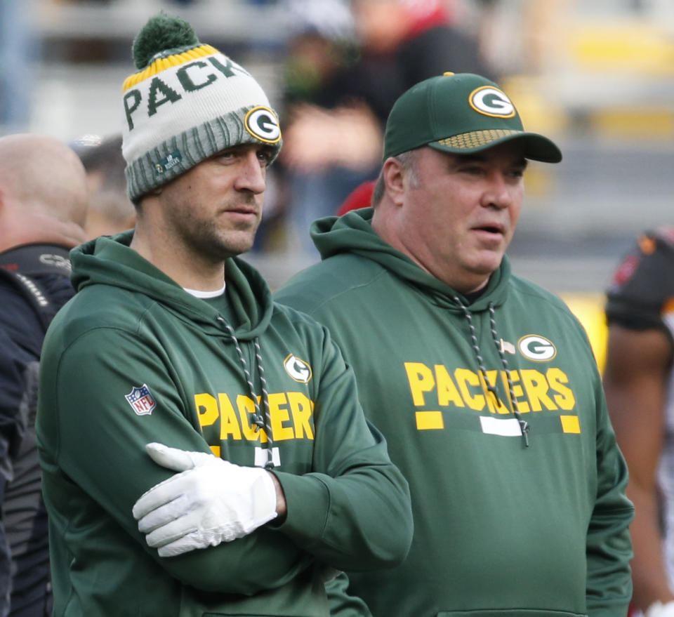 Packers quarterback Aaron Rodgers, pictured with head coach Mike McCarthy before Green Bay’s Week 13 win over visiting Tampa Bay, was a spectator for the sixth time since suffering a collarbone injury against Minnesota on Oct. 15. (AP)