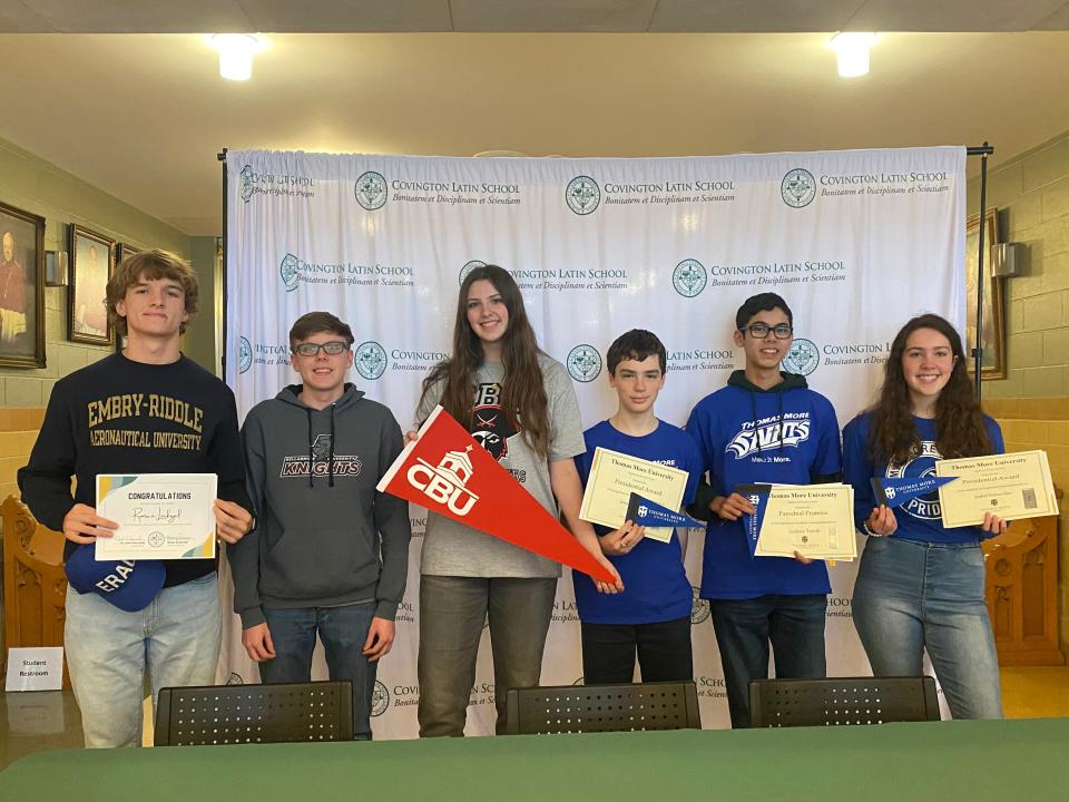 Covington Latin School celebrated six athletes who signed their letters of intent to play college sports. They are, from left: Roman Linkugel, rowing, Embry Riddle Aeronautical University; Liam  Connelly, swimming, Bellarmine University; Calah Jackson, volleyball, Christian Brother University; Jon Miller, archery, Thomas More University; Zach Trauth, archery, Thomas More University and Isabel Enzweiler, archery, Thomas More University.