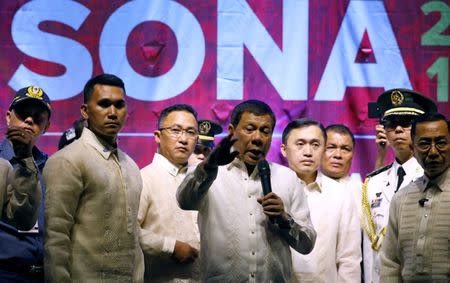 Philippine President Rodrigo Duterte speaks to protesters after he delivered his State of the Nation address at the Congress in Quezon city, Metro Manila Philippines July 24, 2017. REUTERS/Erik De Castro