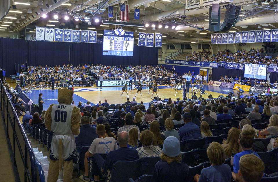 Fans cheer during an NCAA college volleyball game between BYU and Utah State in Provo Utah, Sept. 1, 2022. An investigation by Brigham Young University into allegations that fans engaged in racial heckling and uttered racial slurs at a Duke volleyball player last month found no evidence to support the claim. (Leah Hogsten/The Salt Lake Tribune via AP)