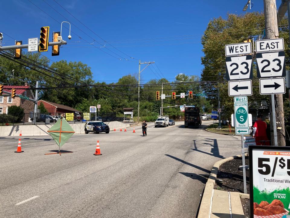 Pennsylvania State Police armed with long guns direct traffic at the intersection of routes 100 and 23 in South Coventry Township in northern Chester County, Pa. on Tuesday, Sept. 12, 2023. Route 100 remains closed to traffic from Route 401 to Route 23.