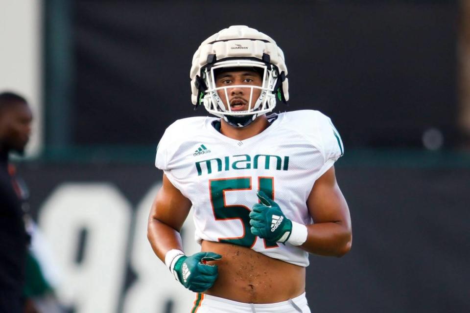 Miami Hurricanes linebacker Francisco Mauigoa (51) works out during football practice at the University of Miami campus in Coral Gables, Florida, Thursday, March 23, 2023.