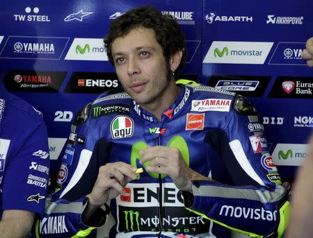 FILE PHOTO: Yamaha MotoGP rider Valentino Rossi of Italy looks on before the third qualifying session ahead of the Valencia Motorcycle Grand Prix at the Ricardo Tormo racetrack in Cheste near Valencia, Spain, November 7, 2015. REUTERS/Heino Kalis