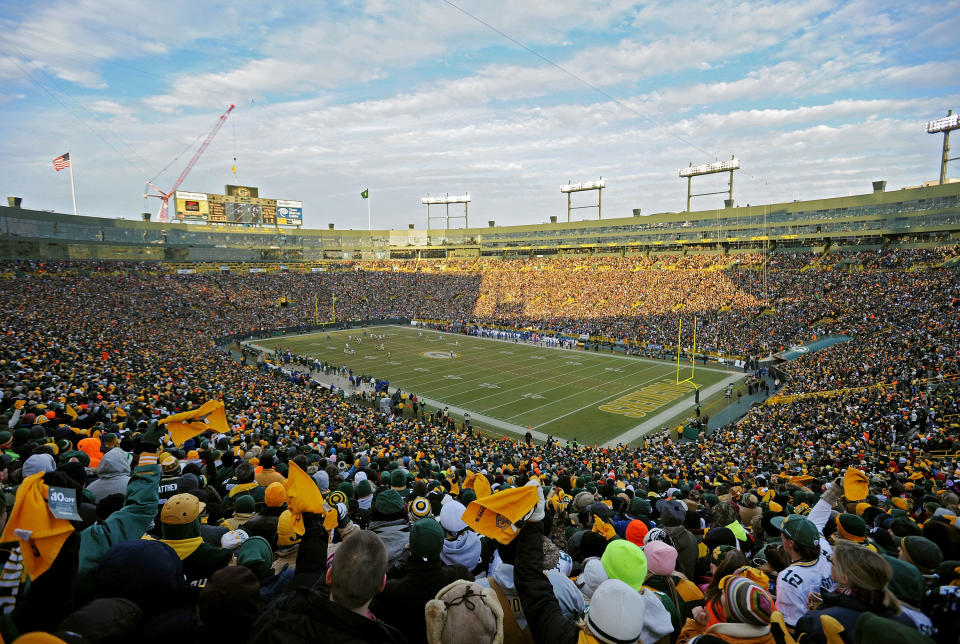 GREEN BAY, WI - JANUARY 15: Fans cheer as the the Green Bay Packers play against the New York Giants during their NFC Divisional playoff game at Lambeau Field on January 15, 2012 in Green Bay, Wisconsin. (Photo by Michael Heiman/Getty Images)