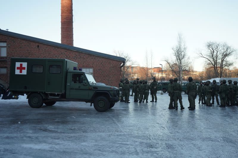 Finnish military police officers take part in a security drill in Vanhankaupunginkoski, in Helsinki