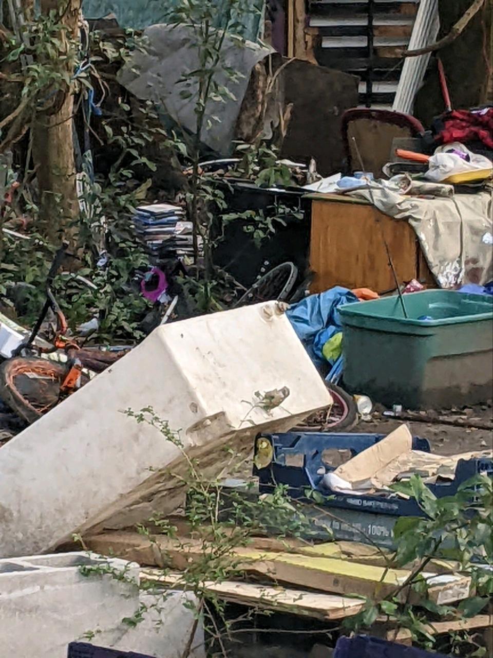 An Escambia County magistrate ordered the owners of a property in Brent to clean up a homeless encampment with derelict structures, trash and abandoned vehicles by April 21, 2023, but two days before the deadline no action had been taken.